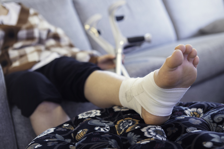 injured person reclining on a couch